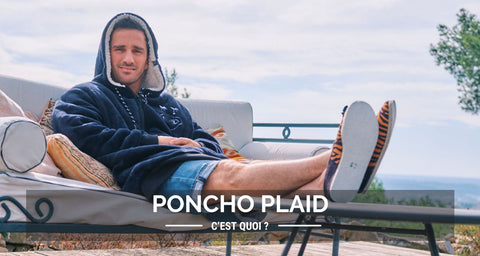 Un homme allongé avec un poncho plaid qui se demande qu'est-ce que c'est qu'un poncho plaid