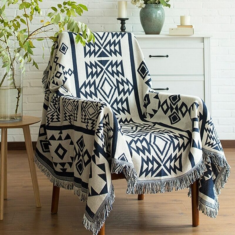 Scandinavian throw with blue geometric patterns on an armchair